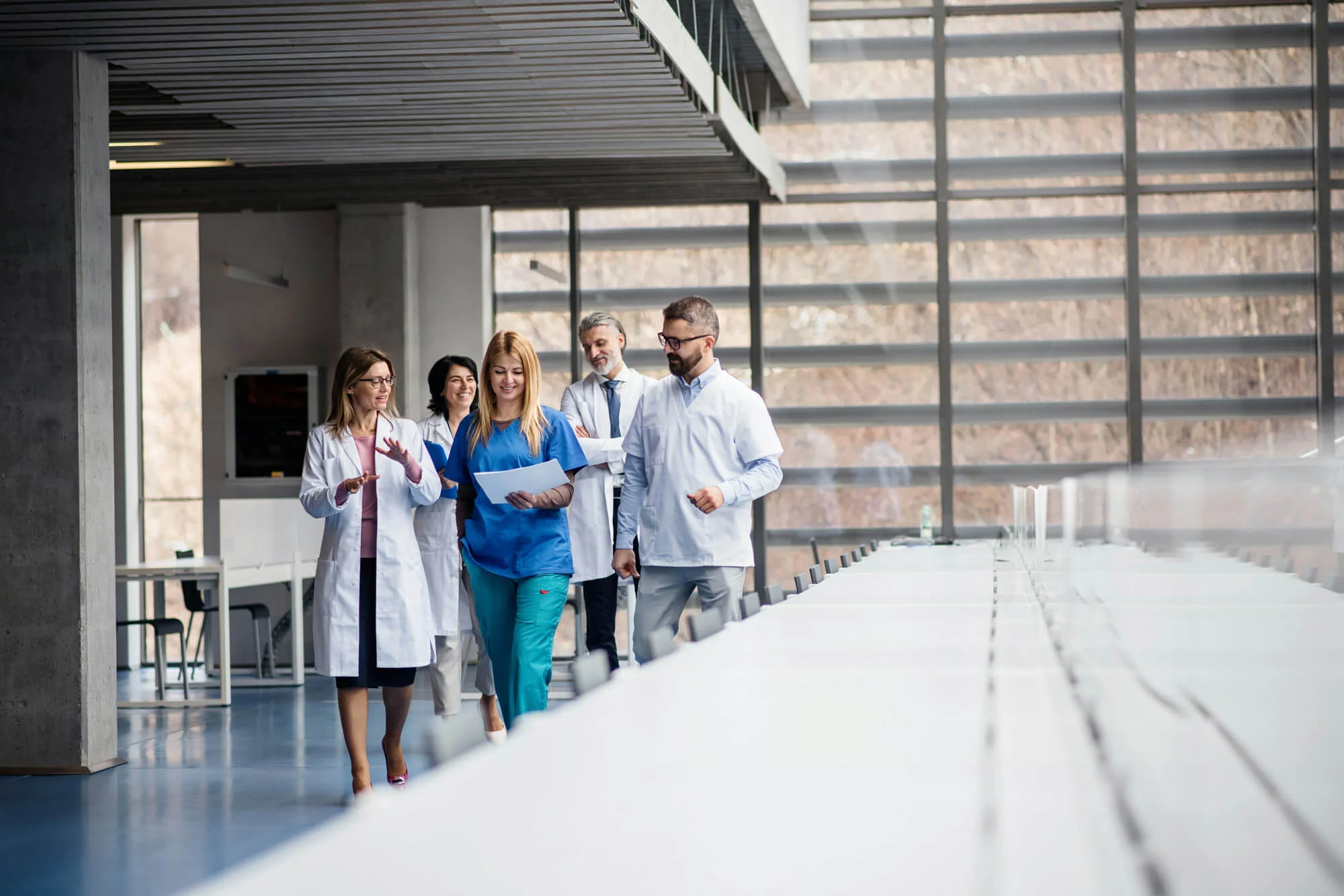 a group of medical professionals walking through an office